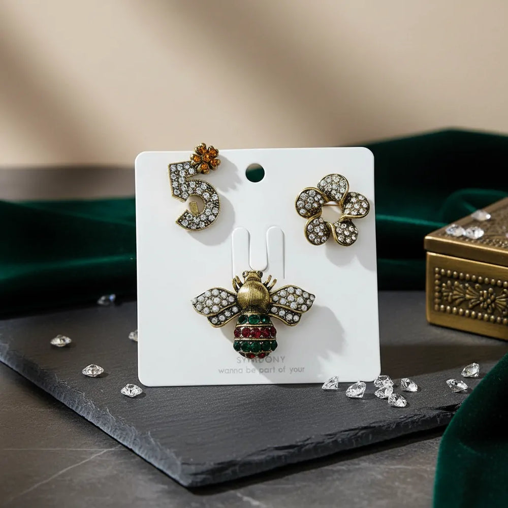 Set 3 Spille Gioiello Iconiche - Ape Regina, Numero 5 e Fiore con Strass