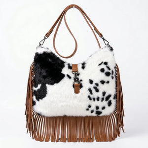 Borsa hobo animalier con frange e tracolla, pezzato bianco e nero