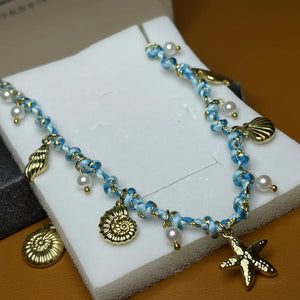 Costa Azzurra - Girocollo collana Catena Oro con Ciondoli marini conchiglie celeste