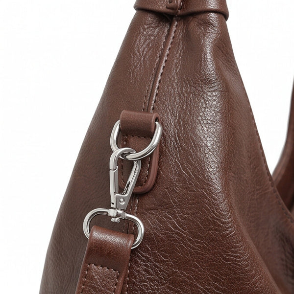 Borsa donna arrotondata con manici intrecciati e tracolla con nodo monomanico
