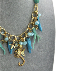 Parure Collana e bracciale turchese lunga stelle marine corallo perle rami mare